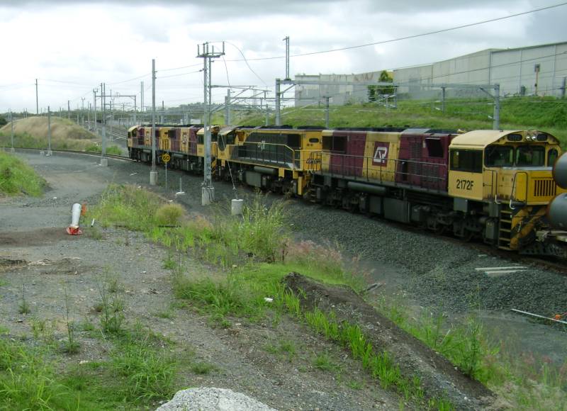 Quadruple header on UP pipe train.  UP sub loop line to Darra West
